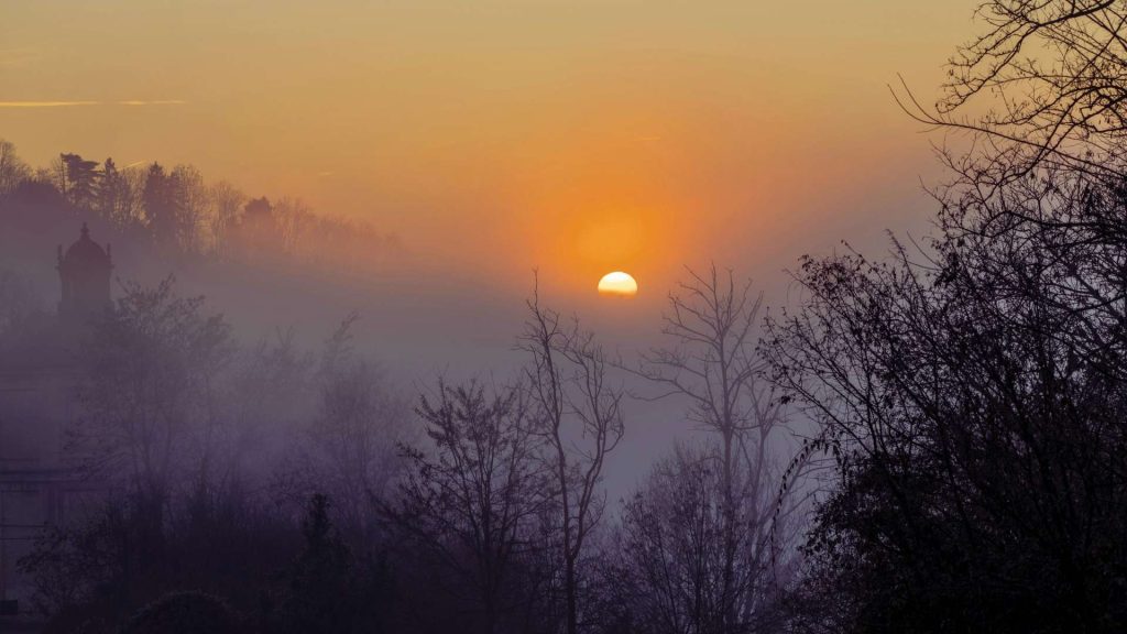 Sun rising through fog, symbolizing hope and recovery from the dangers of fentanyl.