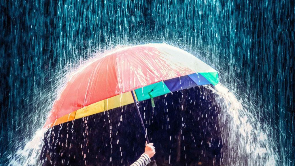 Umbrella blocking heavy rain as a metaphor for Vivitrol preventing relapse.