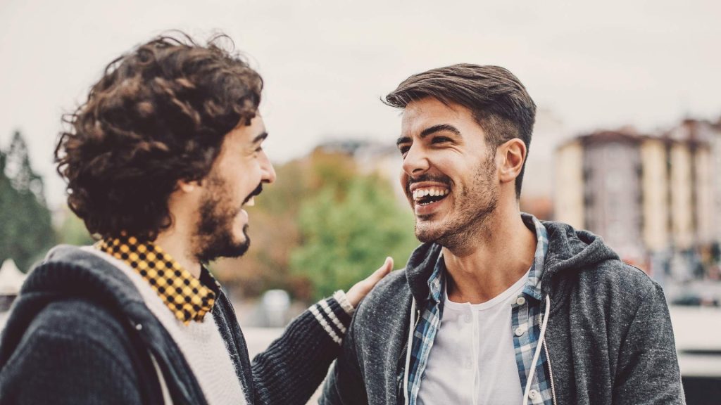 Two friends sharing a supportive moment during recovery.