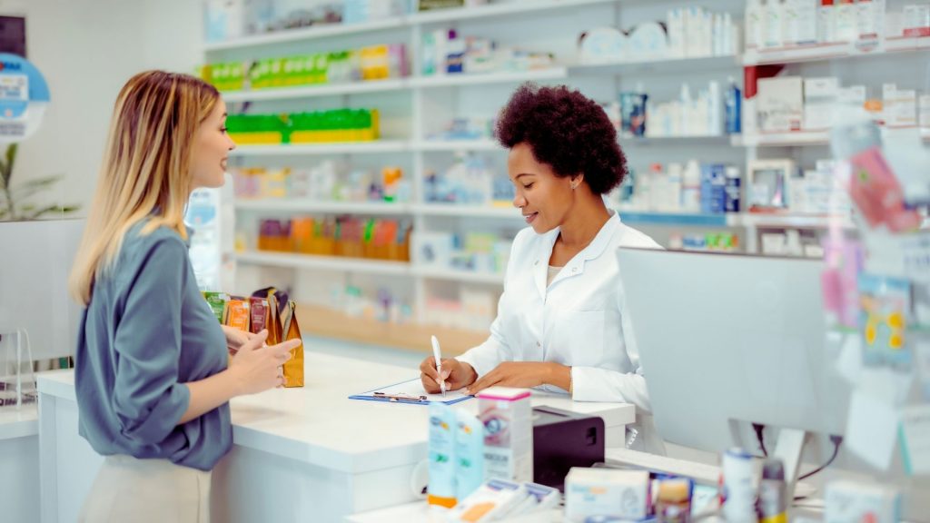 Patient receiving guidance at a pharmacy about Suboxone medication under Idaho Medicaid coverage