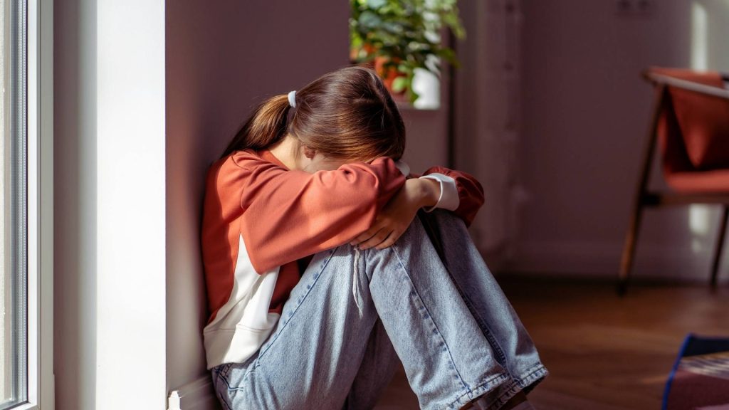 Addiction and Family: Understanding the Ripple Effects 3 Teen experiencing emotional distress from family addiction stress
