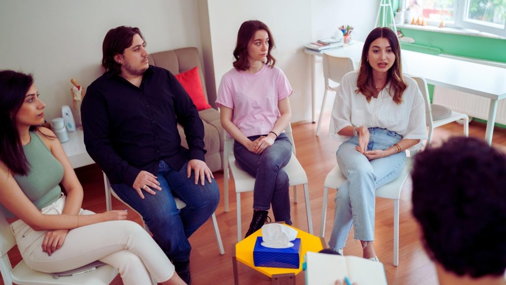 Group therapy session as part of IOP addiction treatment and recovery support