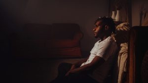 Treatment-Resistant Depression hero image of a man sitting with depression.